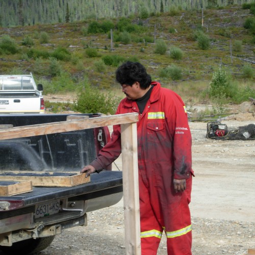 Local help from the community of Tsay Keh Dene. Core cutter Henry Isaac